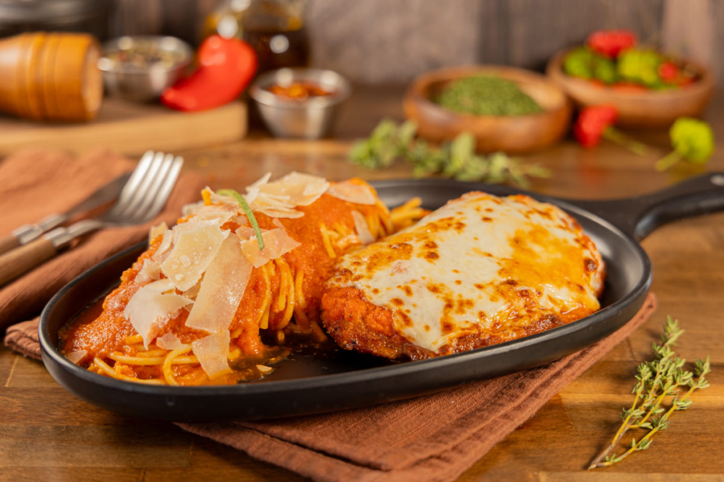 Beef parmigiana with spaghetti served at Kingdom BBQ & Grill in Orlando