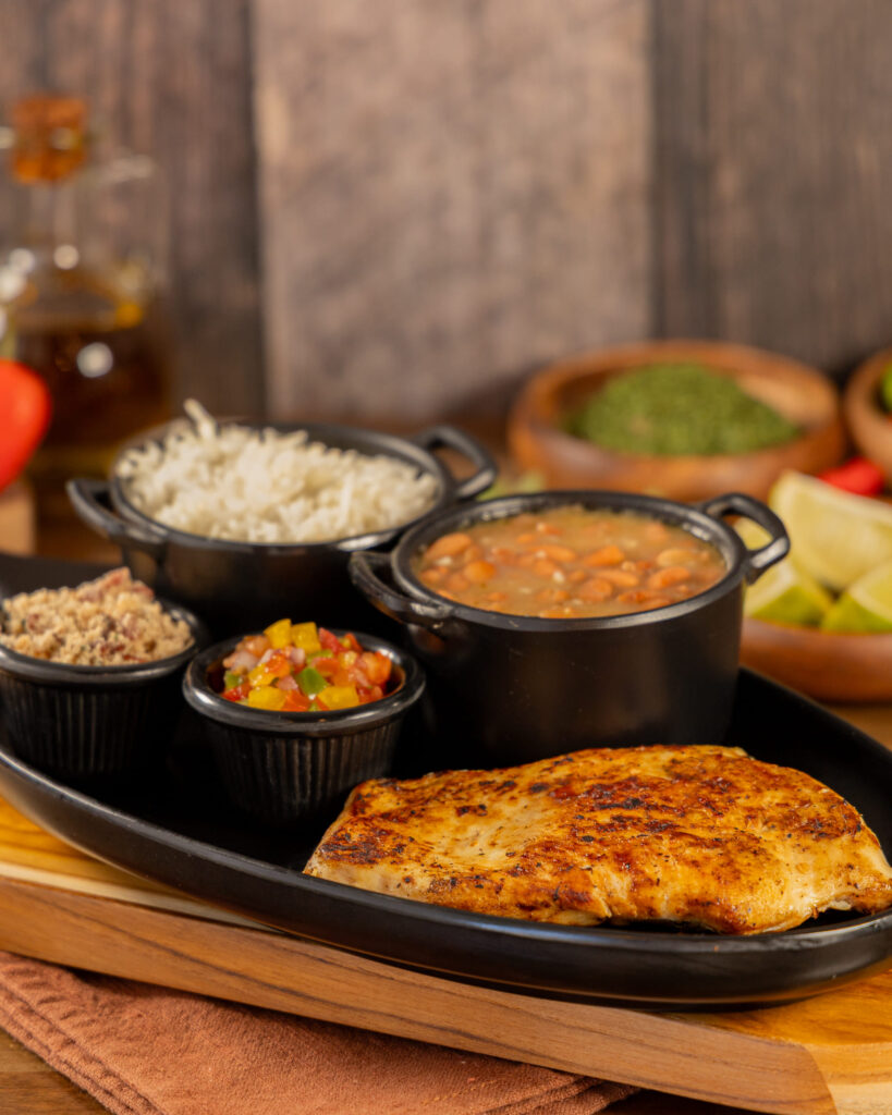 Grilled chicken breast with Brazilian side dishes