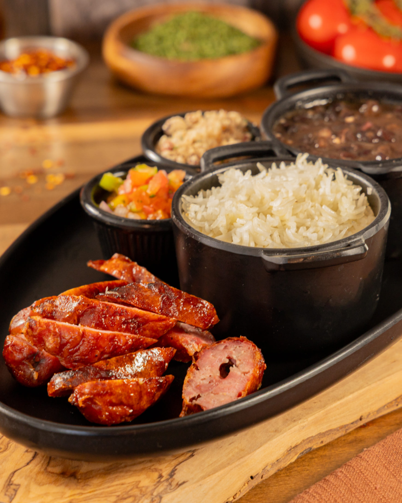 Brazilian pork sausage with rice, beans, and farofa