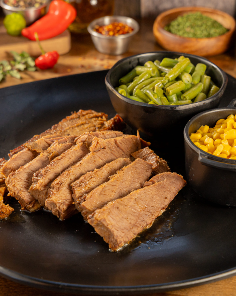 Family-style roast beef brisket with Brazilian sides