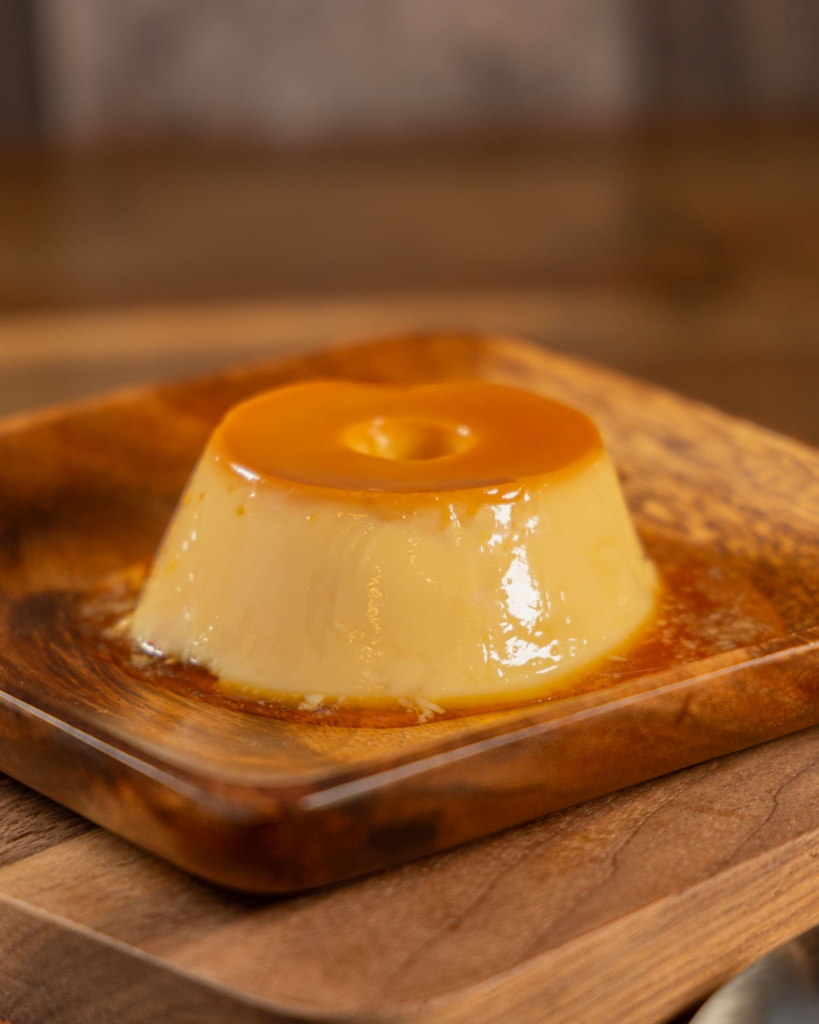 Small caramel flan dessert with golden caramel sauce
