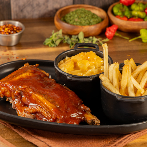 Slow smoked BBQ pork ribs with mac and cheese and fries at Kingdom BBQ & Grill